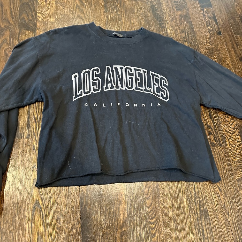 Brandy Melville/ John Galt long sleeve black graphic yes with “Los Angles”